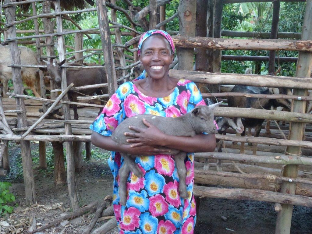 woman holding goat